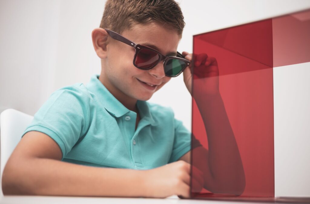 A young boy at the eye doctor for vision therapy to help treat lazy eye.