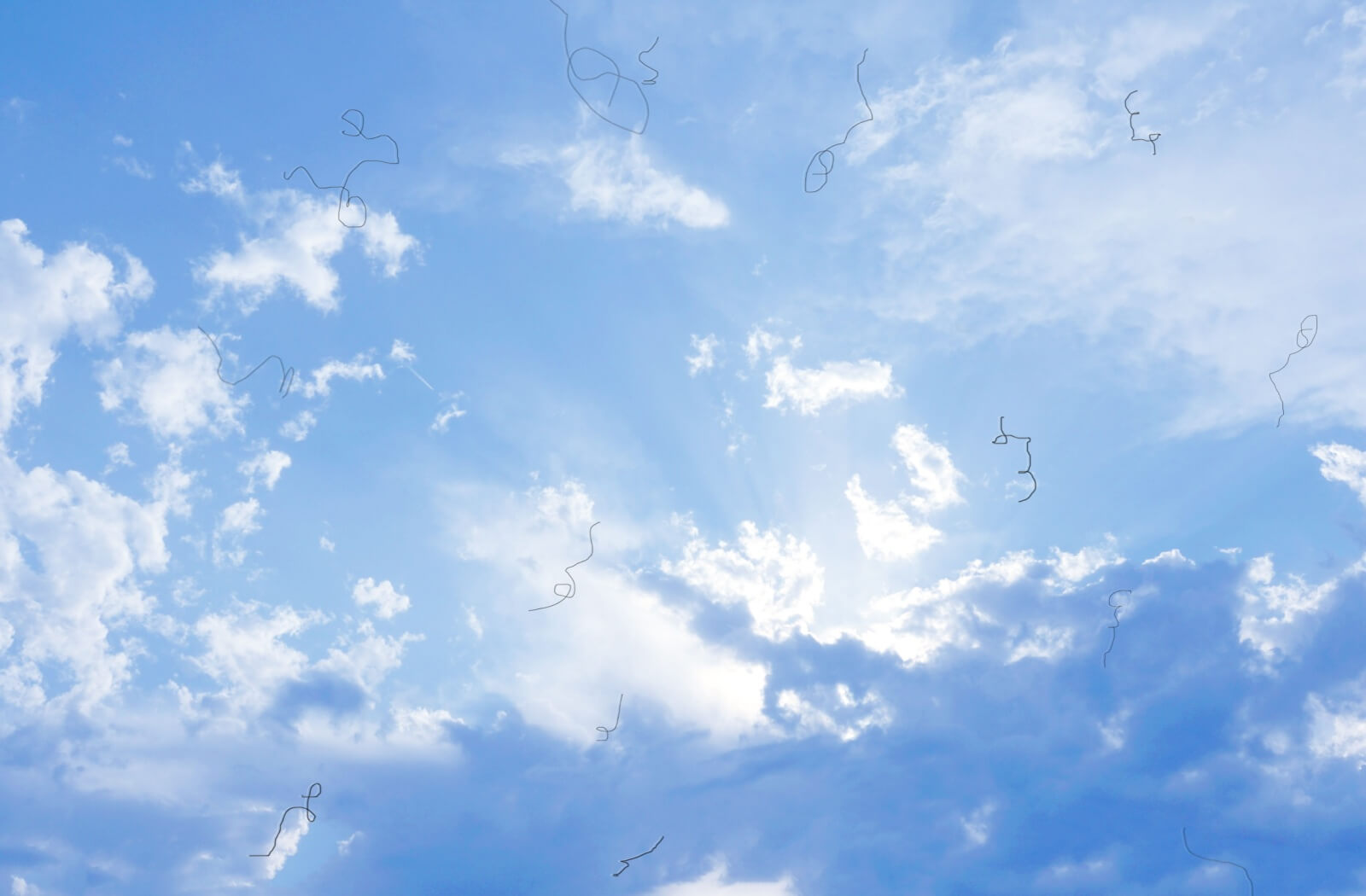 An image of a blue, cloudy sky with black squiggles in it to demonstrate what eye floaters look like.